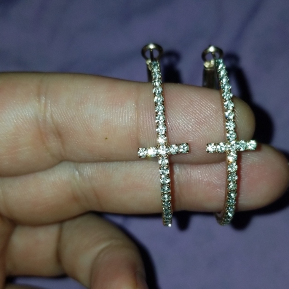 Rose gold and cubic Zirconia cross hoops.